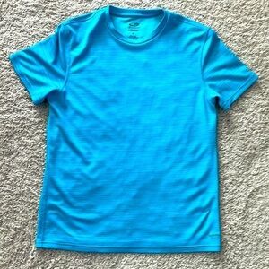 Champion big kids turquoise poly tee SZ M. Duodry. Like new